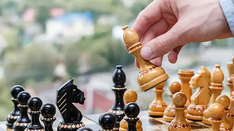 link building versus link outreach chess board move