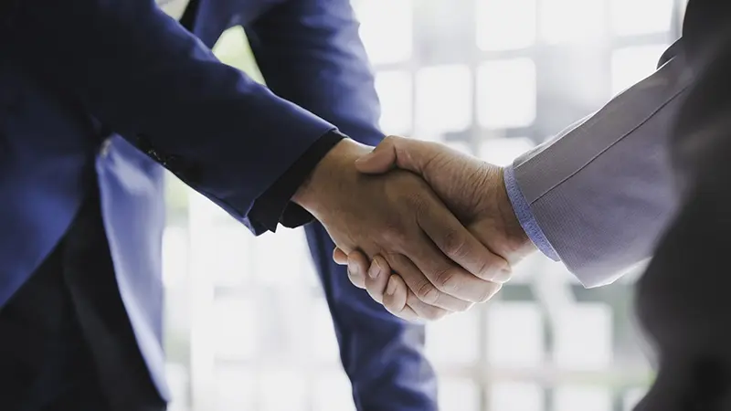 networking business people handshake negotiation deal