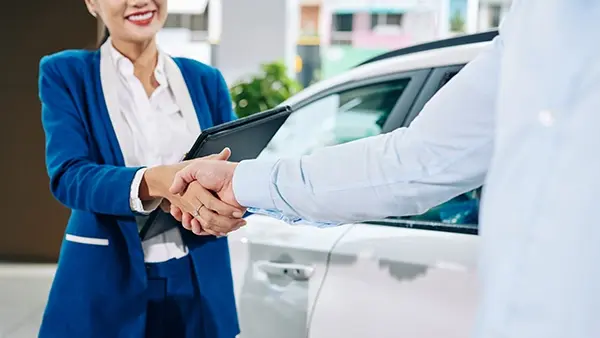 car dealer seo closing deal handshake selling vehicle