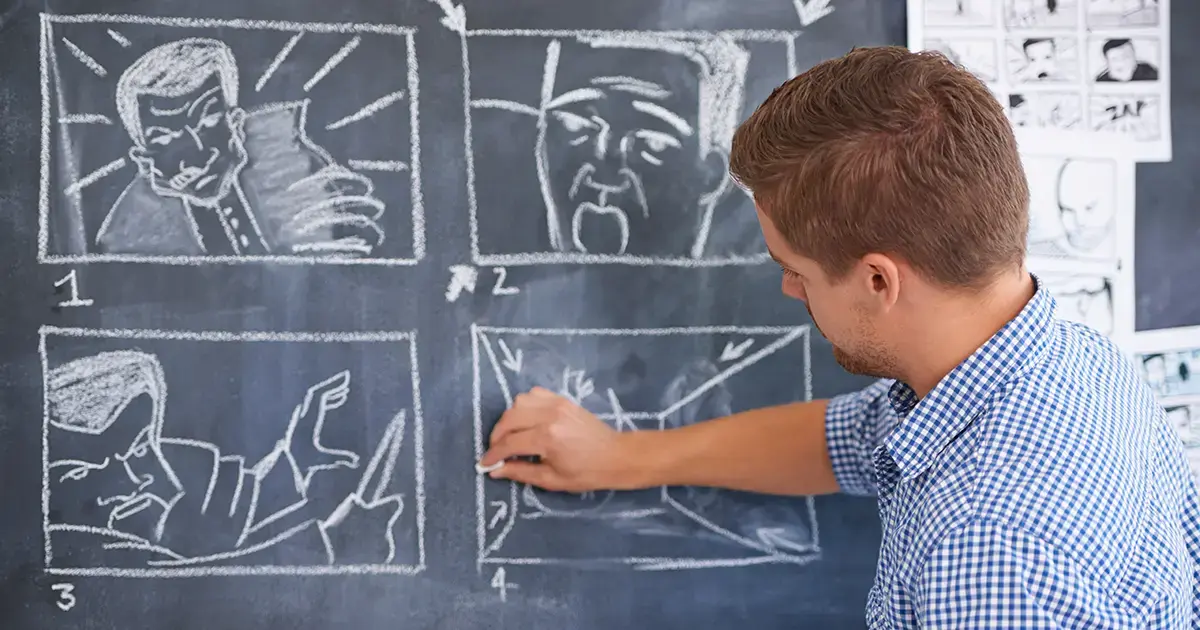video script young man storyboarding on chalkboard